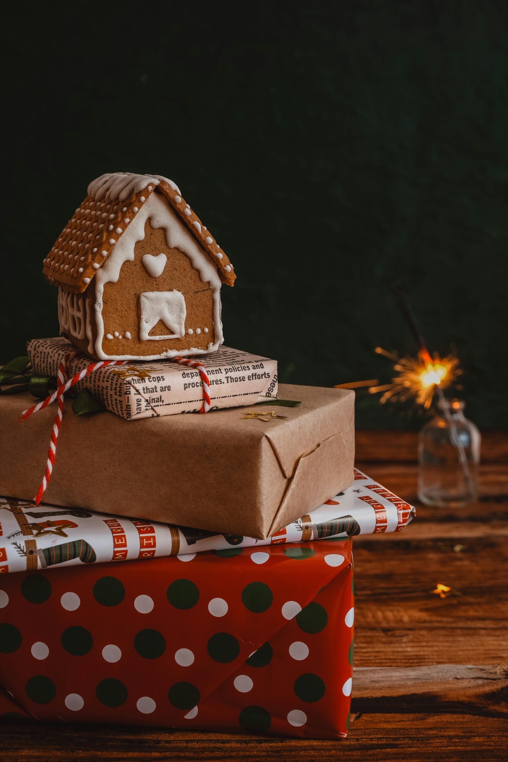 Gingerbread house on a stack of presents